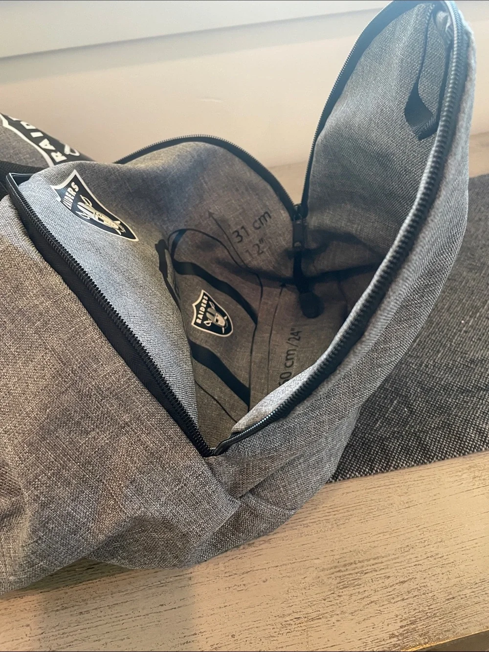 Northwest Gray Duffel Bag with Black Straps and Raiders Logo